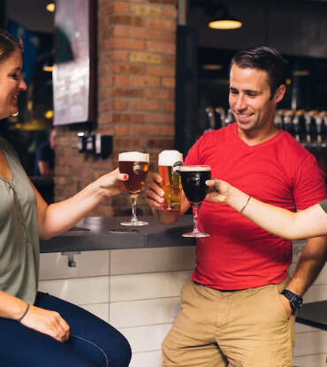 group toasting with beer